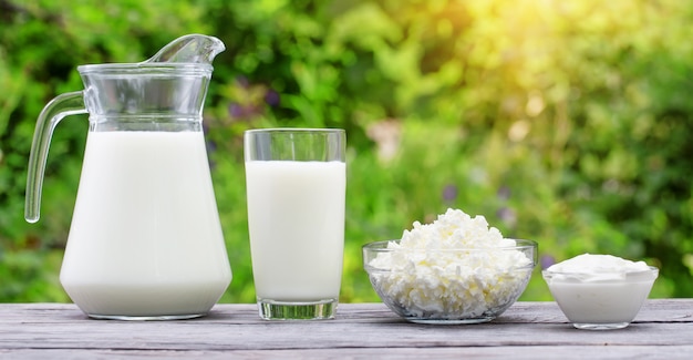 Milk curd and sour cream on a wooden table