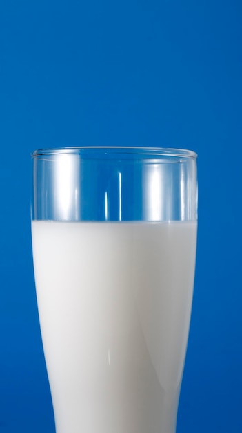 Milk in an hourglass glass