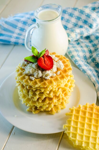 Milk and ripple waffles with cottage cheese and strawberries