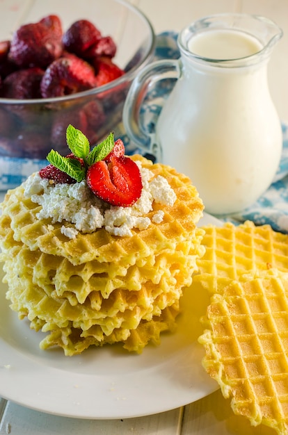 Milk and ripple waffles with cottage cheese and strawberries