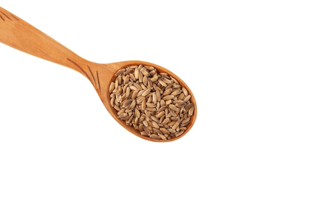 Milk Thistle seeds Silybum marianum plant seeds in wooden spoon on white Natural antioxidant