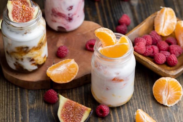 Milk yogurt with tangerine close up