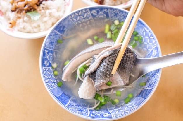 Milkfish skin soup, distinctive Taiwan delicacy food in Tainan. Famous meal set for lunch or breakfast with vegetable, top view, copy space, close up