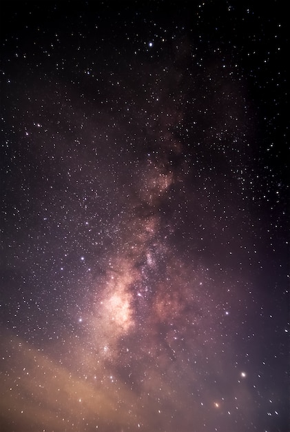 Milky Way galaxy pointing on a bright star background