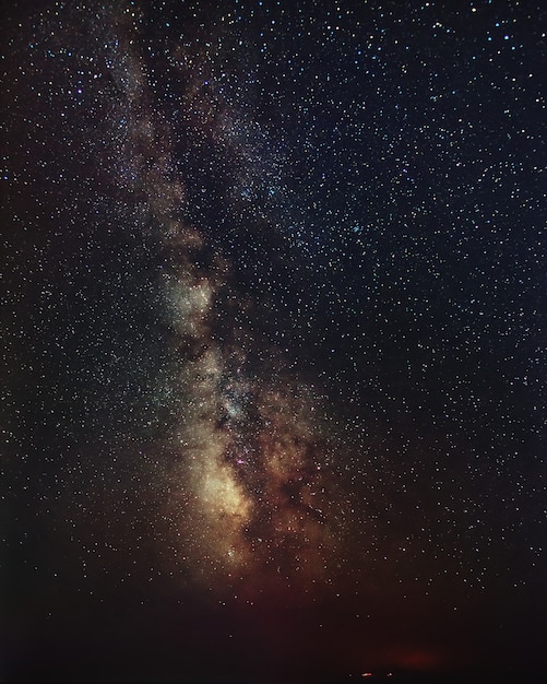 Milky Way galaxy over the rocky seacoast.