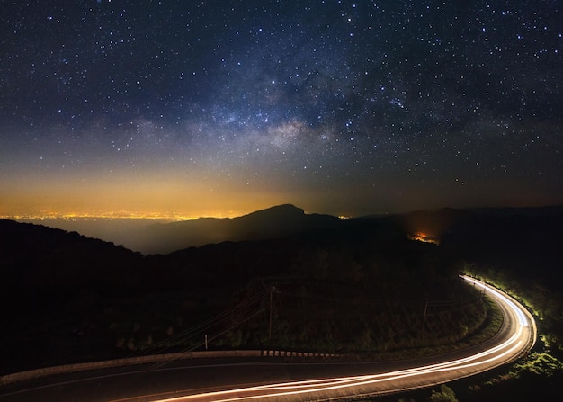 Milky Way Galaxy with lighting on the road at Doi inthanon Chiang mai Thailand