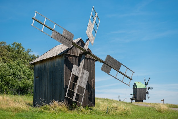 Mill on the wheat field with blue sky