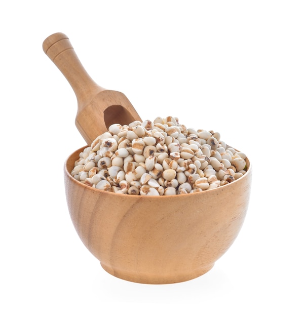 Millet in wood bowl on white background