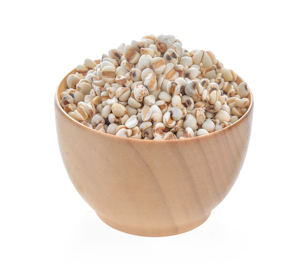 Millet in wood bowl on white background