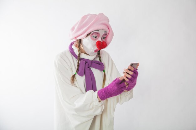 Mime girl with a phone in her hands