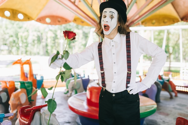 Mime holding a rose in a carousel