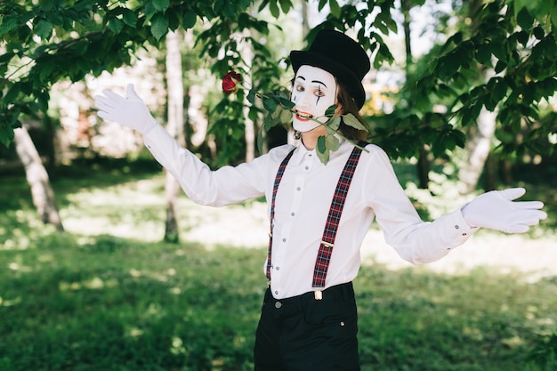 Mime holding a rose with his mouth