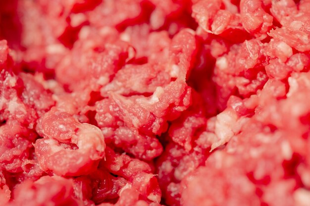 Minced beef close-up in a metal plate. Minced cutlets cooking for dinner. beef, grinder, raw, food, meat, cooking.