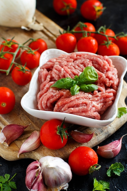 Minced meat in a bowl with vegetables and spices