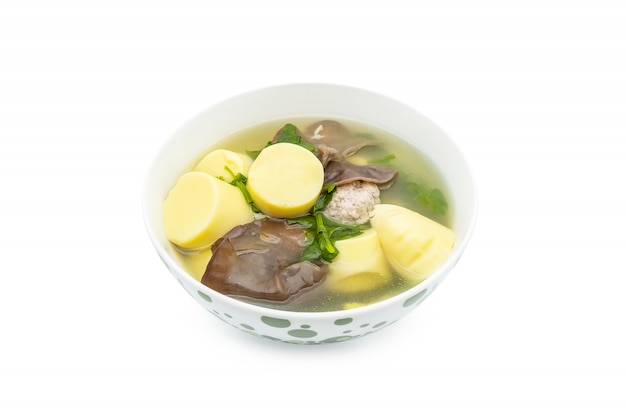 Photo minced pork soup with tofu and mushroom in bowl isolate on white background.