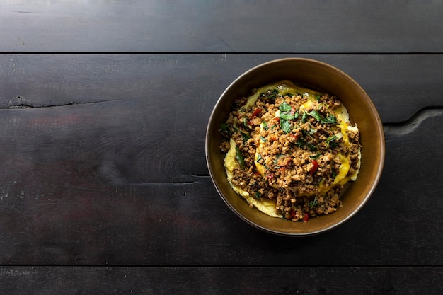 Minced pork with basil rice with laying on the wooden floor top view