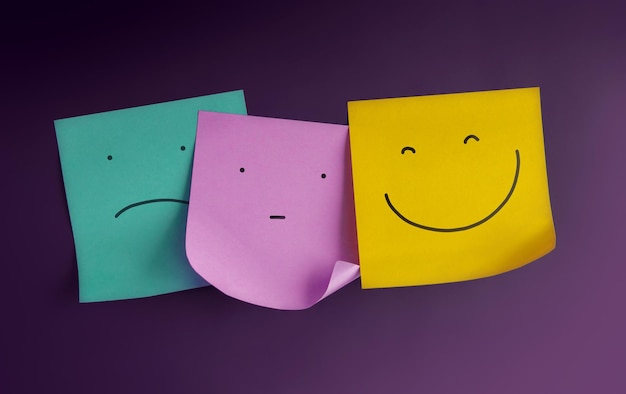 Mind Mental Health Concept Three Emoticon Faces show on Sticky Notes from Negative to Positive Bored to Smiling Face Status of Human Emotion