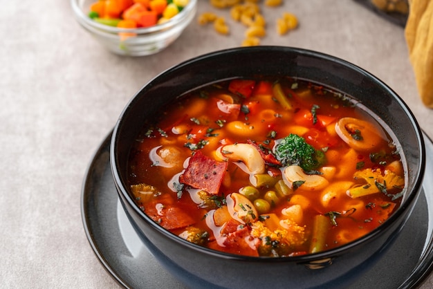 Minestrone Soup is a thick soup of Italian origin made with vegetables and pasta