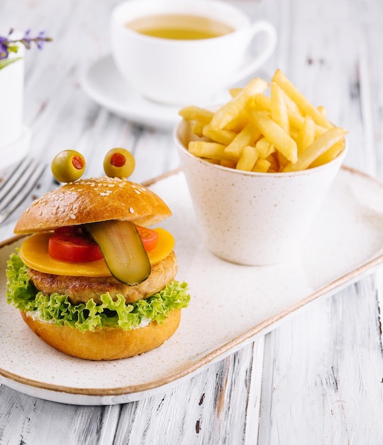 Mini burger shows tongue The concept of a favorite children's burger