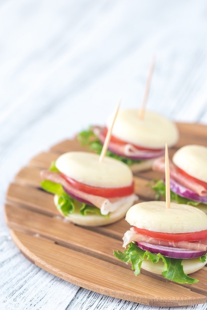 Mini cheese and prosciutto sandwiches