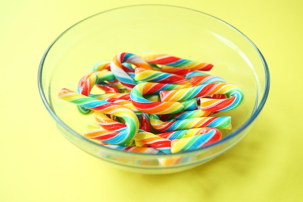 Mini cherry candy canes on white background