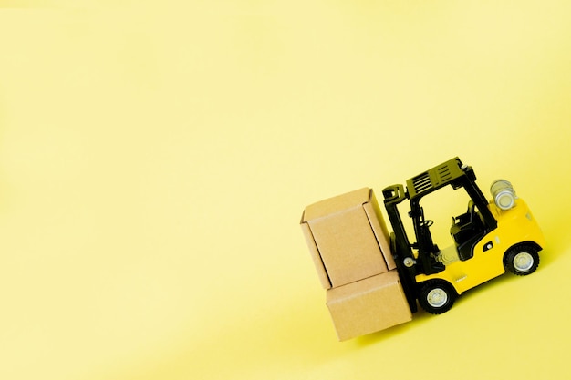 Mini forklift truck load cardboard boxes. Logistics and transportation management ideas and Industry business commercial concept.