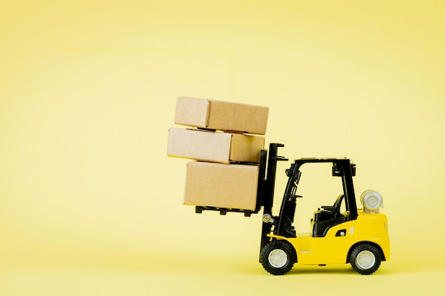 Mini forklift truck load cardboard boxes Logistics and transportation management ideas and Industry business commercial concept