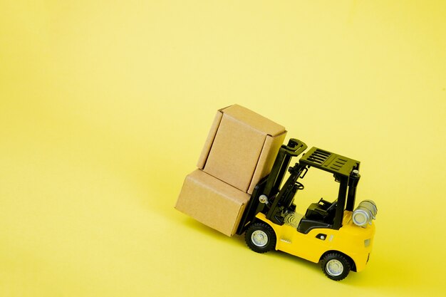 Mini forklift truck load cardboard boxes