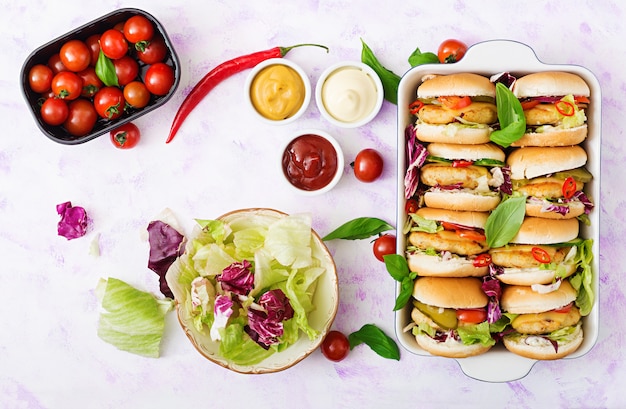 Mini hamburgers with chicken burger, cheese and a vegetables