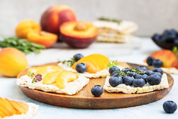 Mini sandwiches with cream cheese and fresh fruits