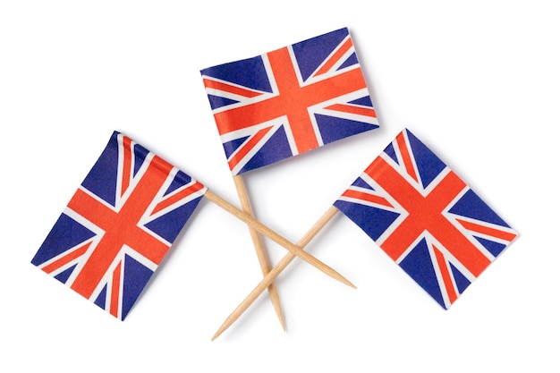 Miniature British flag cocktail sticks on white background