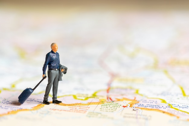 Miniature Business people standing on map , Travel concept