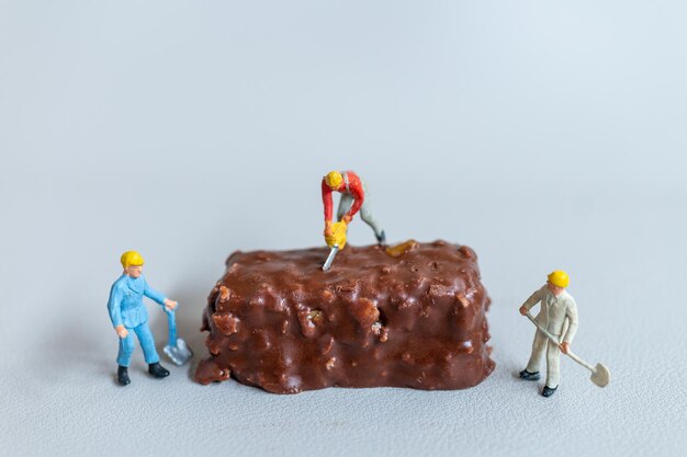 Miniature An employee is making a chocolate bars on gray background World Chocolate Day Concept