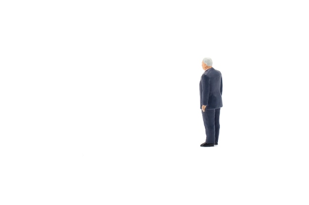 Miniature people businessman on white background