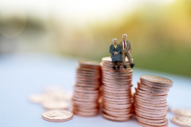 Miniature people on coins