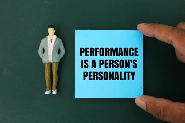 miniature people and colored paper with the word performance is a persons personality