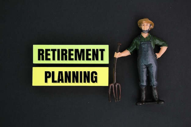 miniature people and colored paper with the words Retirement Planning Ald age planning