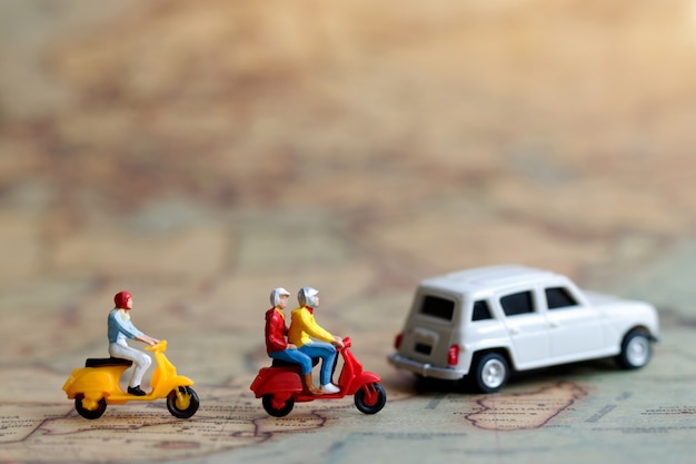 Miniature people traveling