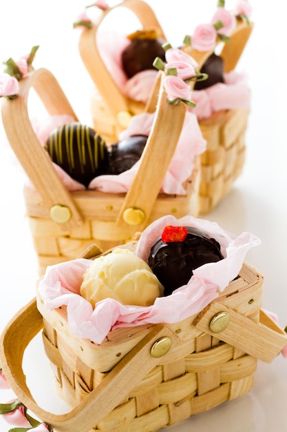 Miniature picnic baskets favor boxes filled with truffles.