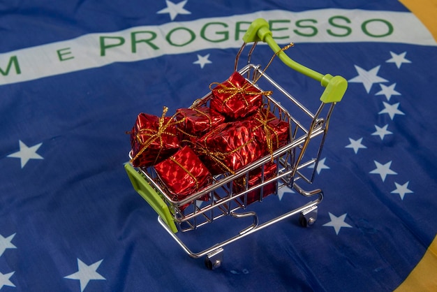 Miniature of shopping cart with gifts inside