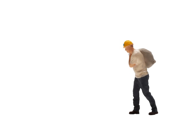 Miniature worker isolated on white background with clipping path