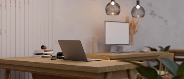 Minimal and comfortable office workspace interior design with laptop computer on wooden table