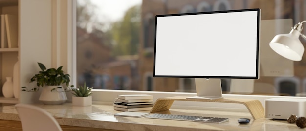 Minimal comfortable working space withPC desktop computer mockup on the table over the window