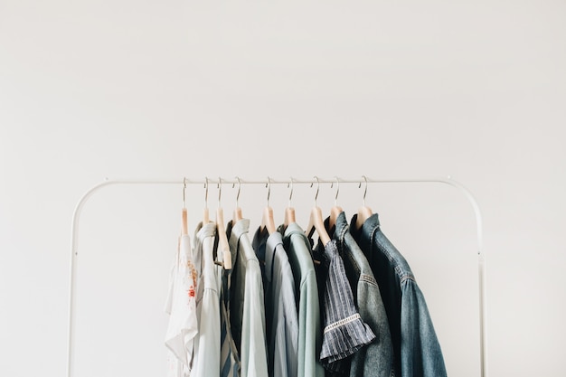 Minimal fashion concept. Female clothes on hanger on white