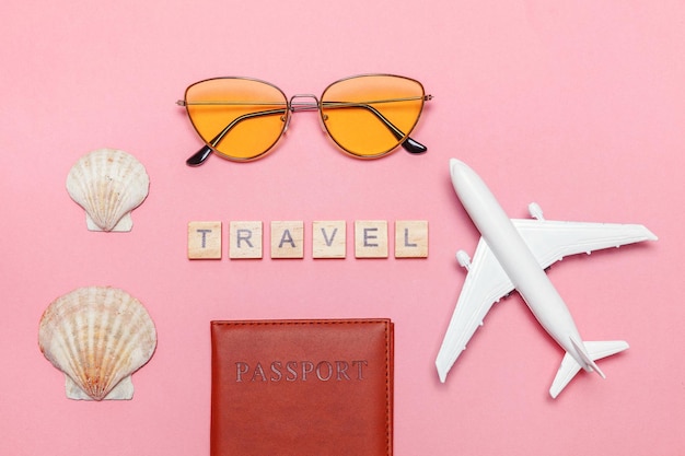 Minimal simple flat lay travel adventure trip concept on pink pastel trendy modern background