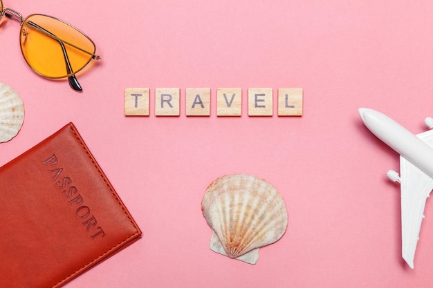 Minimal simple flat lay travel adventure trip concept on pink pastel trendy modern background