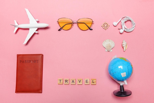 Minimal simple flat lay travel adventure trip concept on pink pastel trendy modern background