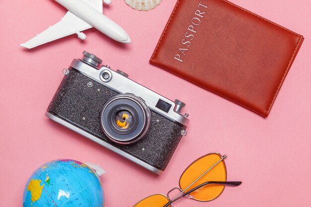 Minimal simple flat lay travel adventure trip concept on pink pastel trendy modern background