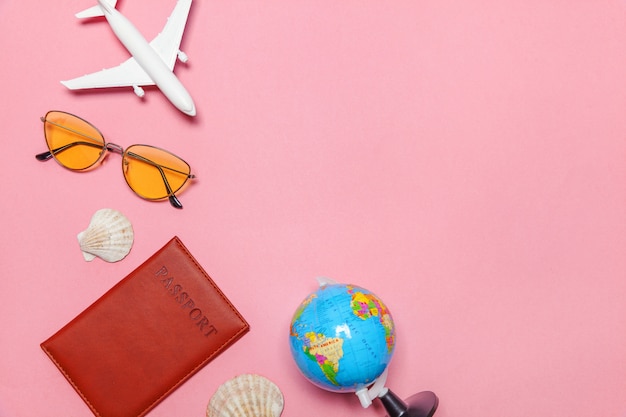 Minimal simple flat lay travel adventure trip concept on pink pastel trendy modern background