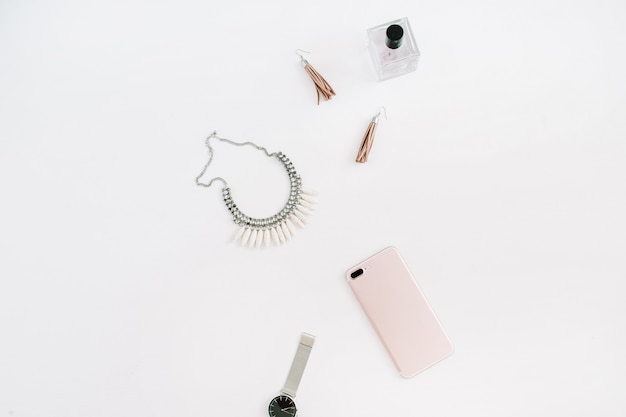 Minimal women's fashion accessories and smartphone